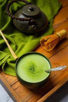 hot-green-tea-glass-with-cream-topped-with-green-tea-decorated-with-green-tea-powder